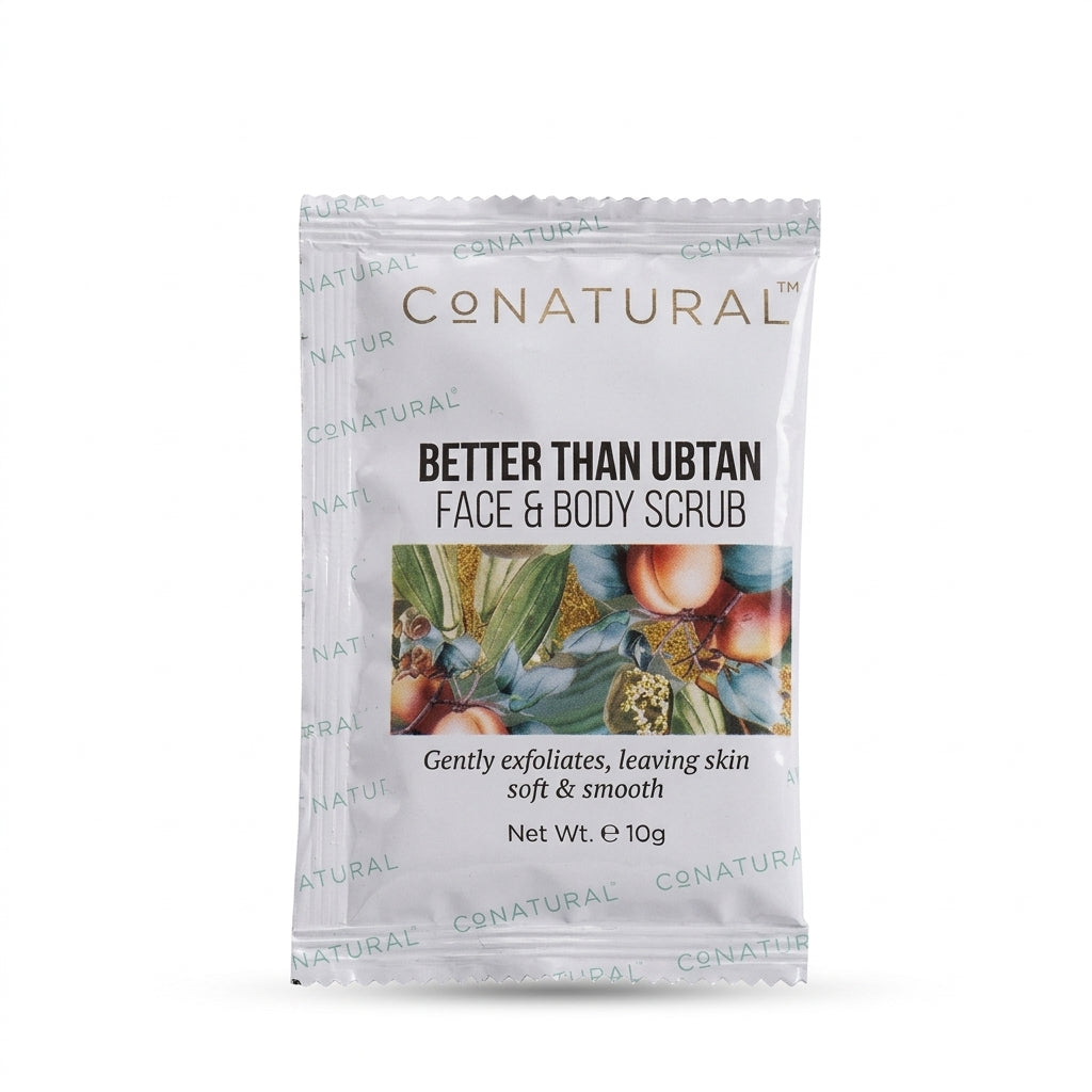 A single packet of CONatural Better Than Ubtan Face & Body Scrub, 10g, on a plain white background.