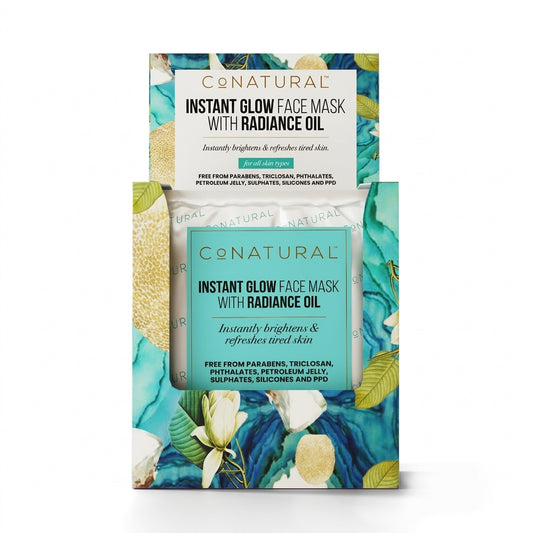 Conatural Instant Glow Face Mask with Radiance Oil in a 3D-printed packaging box featuring a turquoise and green tropical floral design.