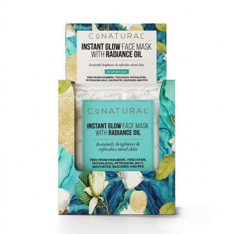 Conatural Instant Glow Face Mask with Radiance Oil in a 3D-printed packaging box featuring a turquoise and green tropical floral design.