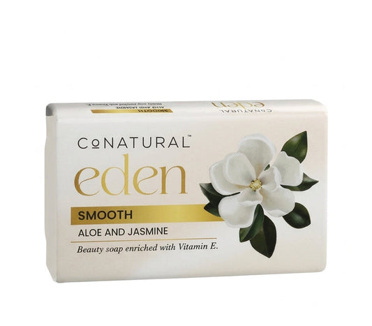 A rectangular bar of ConNatural Eden Smooth Aloe and Jasmine beauty soap in a cream-colored box with gold lettering and a white magnolia flower illustration, shown on a plain white background.