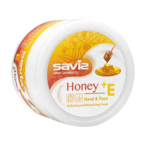 A white plastic pack of Savie Honey + E Hand & Face Softening and Moisturizing Cream on a solid white background.