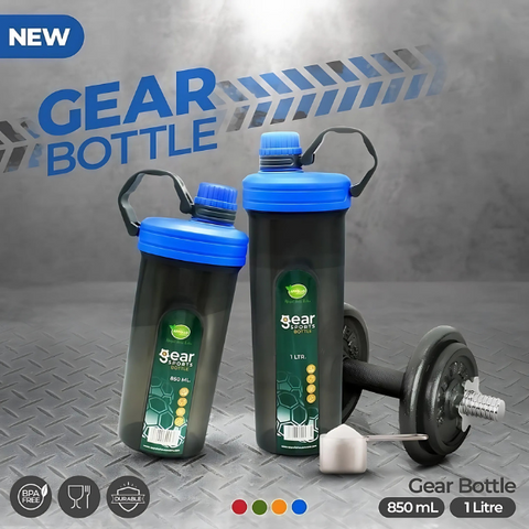 A promotional image featuring two gear sports bottles ( one is 850ml and one is 1 ltr ) with blue caps. the bottles are placed on a textured, industrial background with a dumble nearby, showcasing their durability and design.