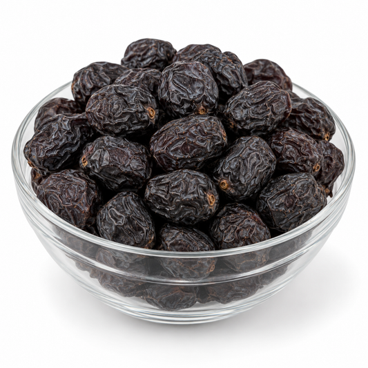 Ajwa dates in a glass bowl