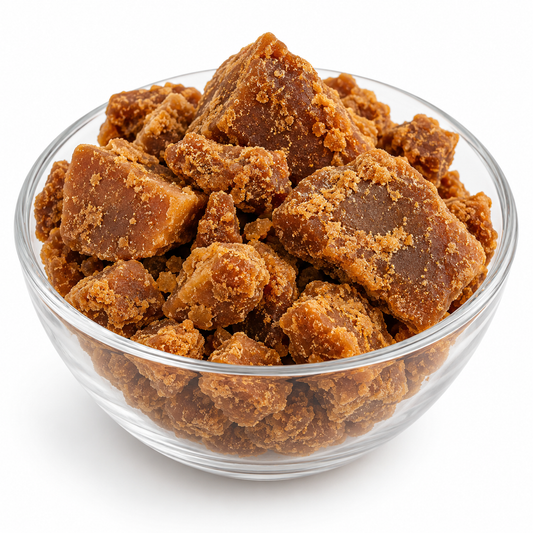 Dark jaggery gur in a glass bowl