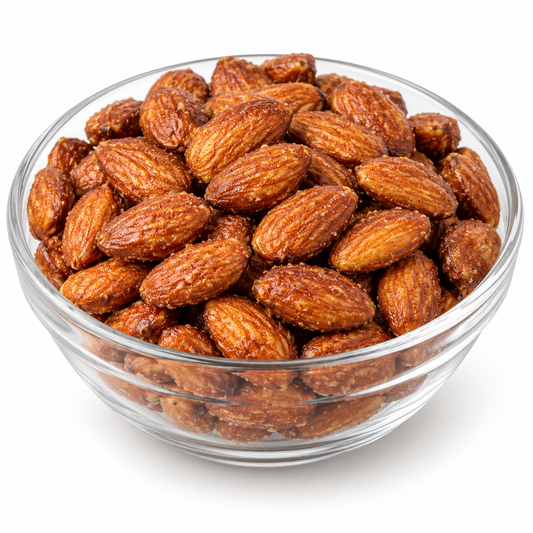 Honey roasted almond kernels in a glass bowl